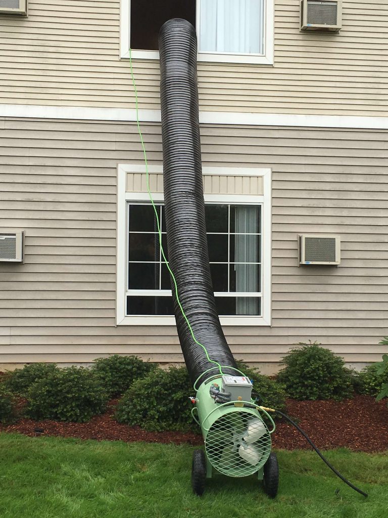 Fan running fresh air to be heated up to the home getting treated for bed bugs.